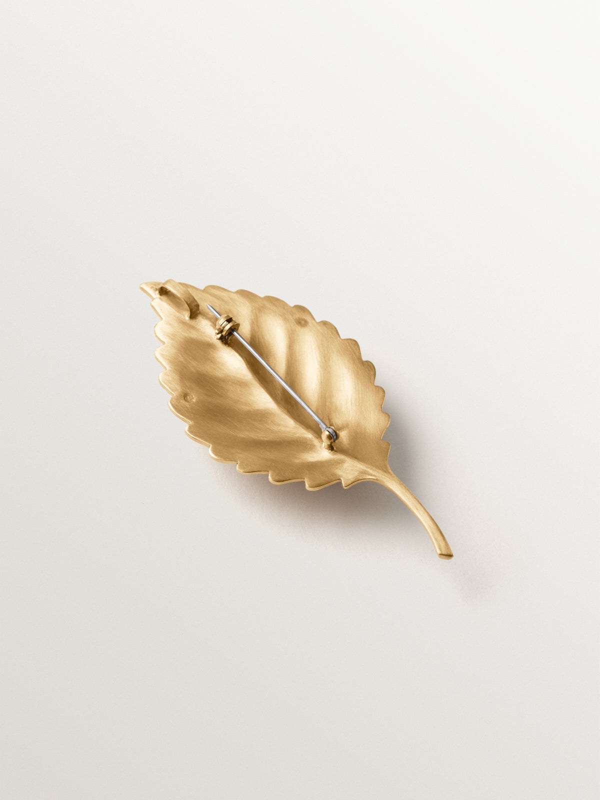 Yellow gold plated brooch-charm with crystals and leaf and insect shape
