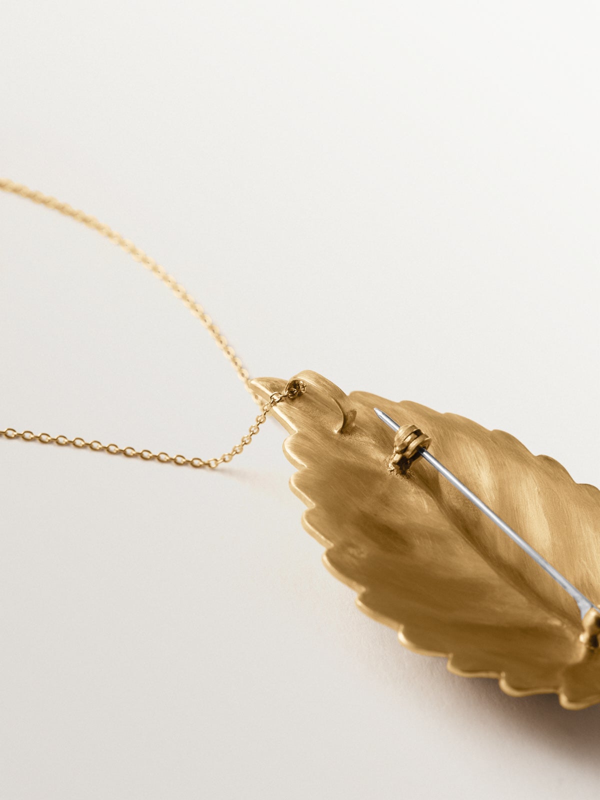 Yellow gold plated brooch-charm with crystals and leaf and insect shape