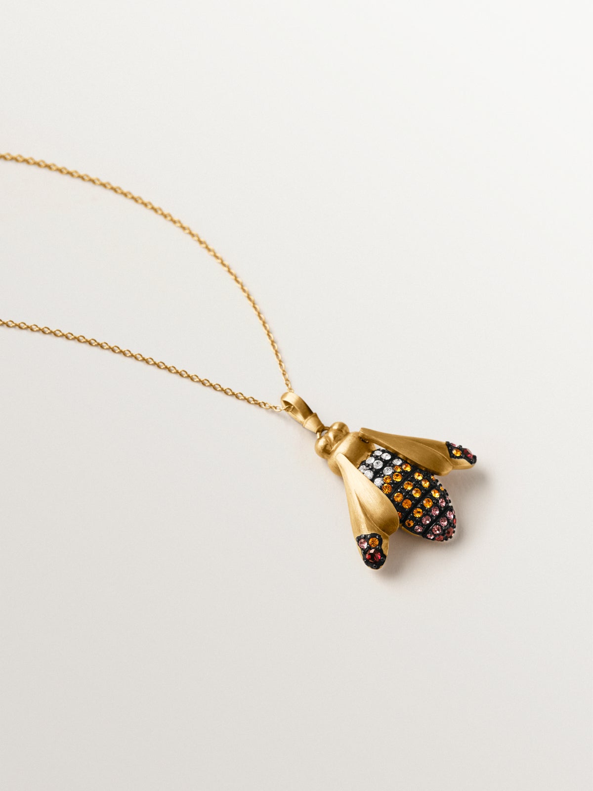 Charm with crystals and dragonfly shape