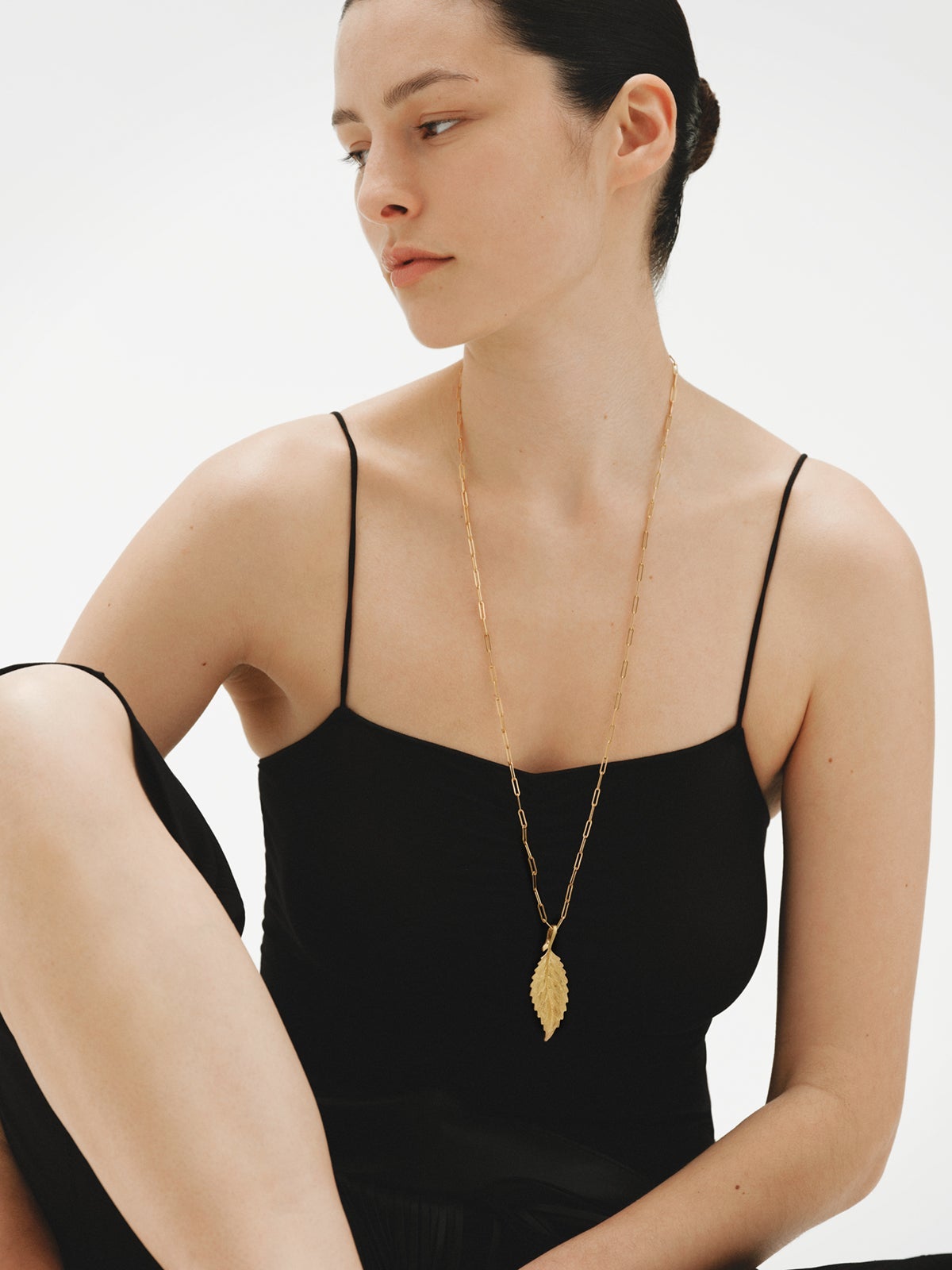 Yellow gold plated charm in leaf shape
