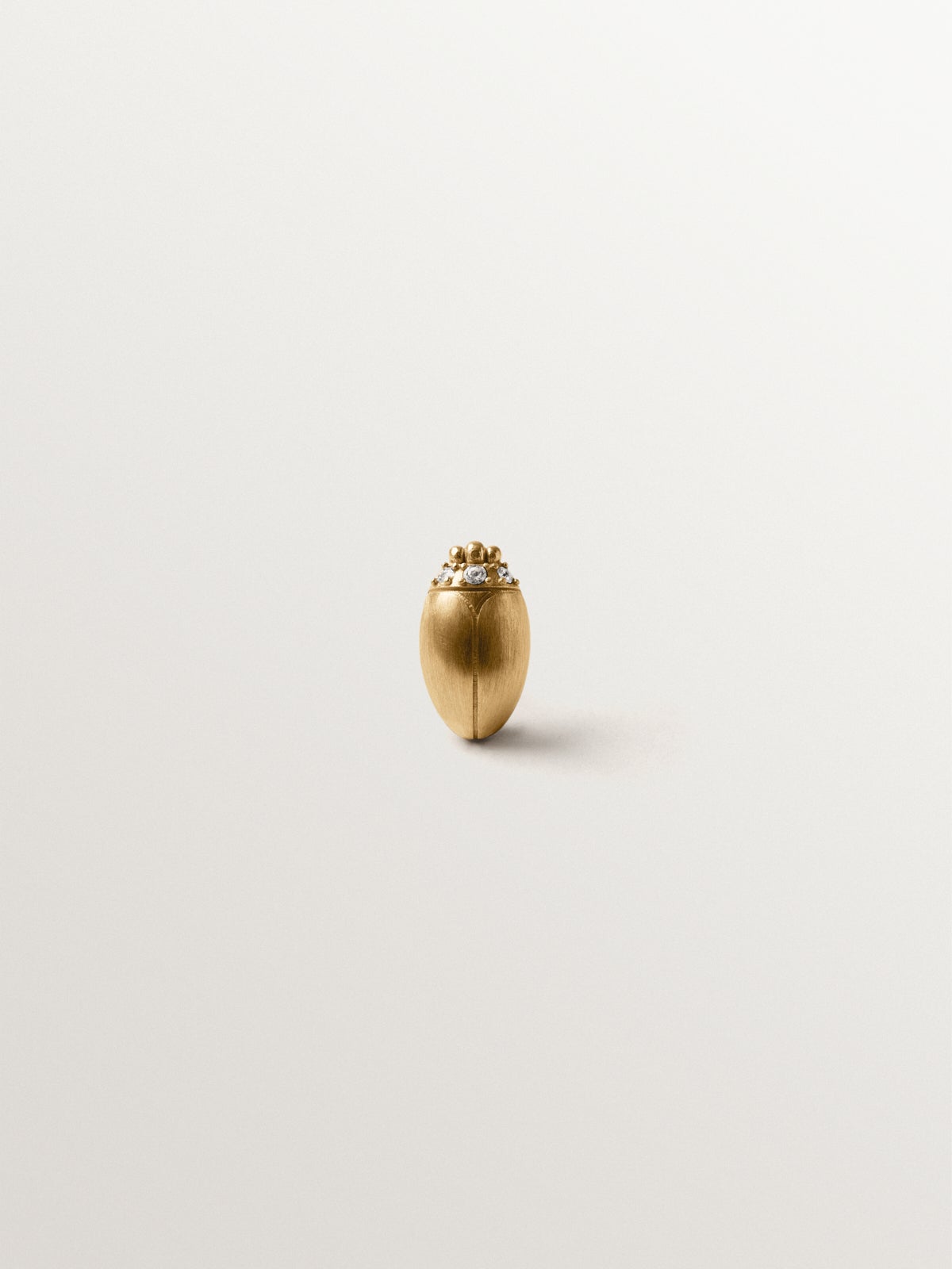 Yellow gold-plated pin with crystal and beetle shape
