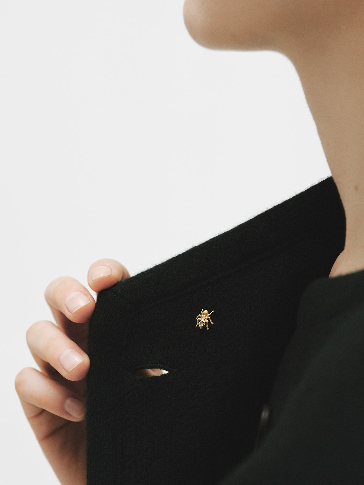 Yellow gold plated pin with crystal and ant shape