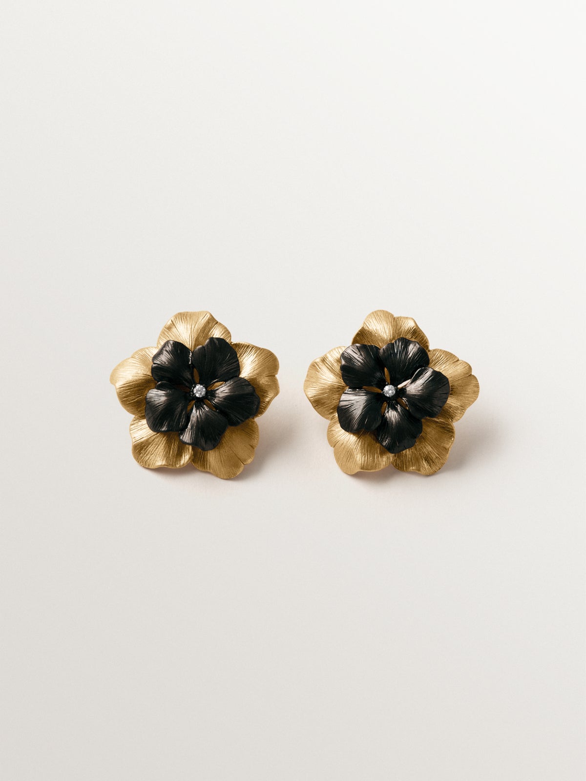 Two-tone yellow gold-plated button earrings with crystal and flower shape
