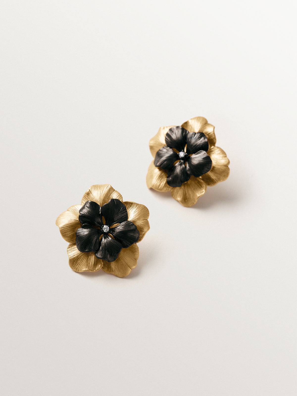 Two-tone yellow gold-plated button earrings with crystal and flower shape
