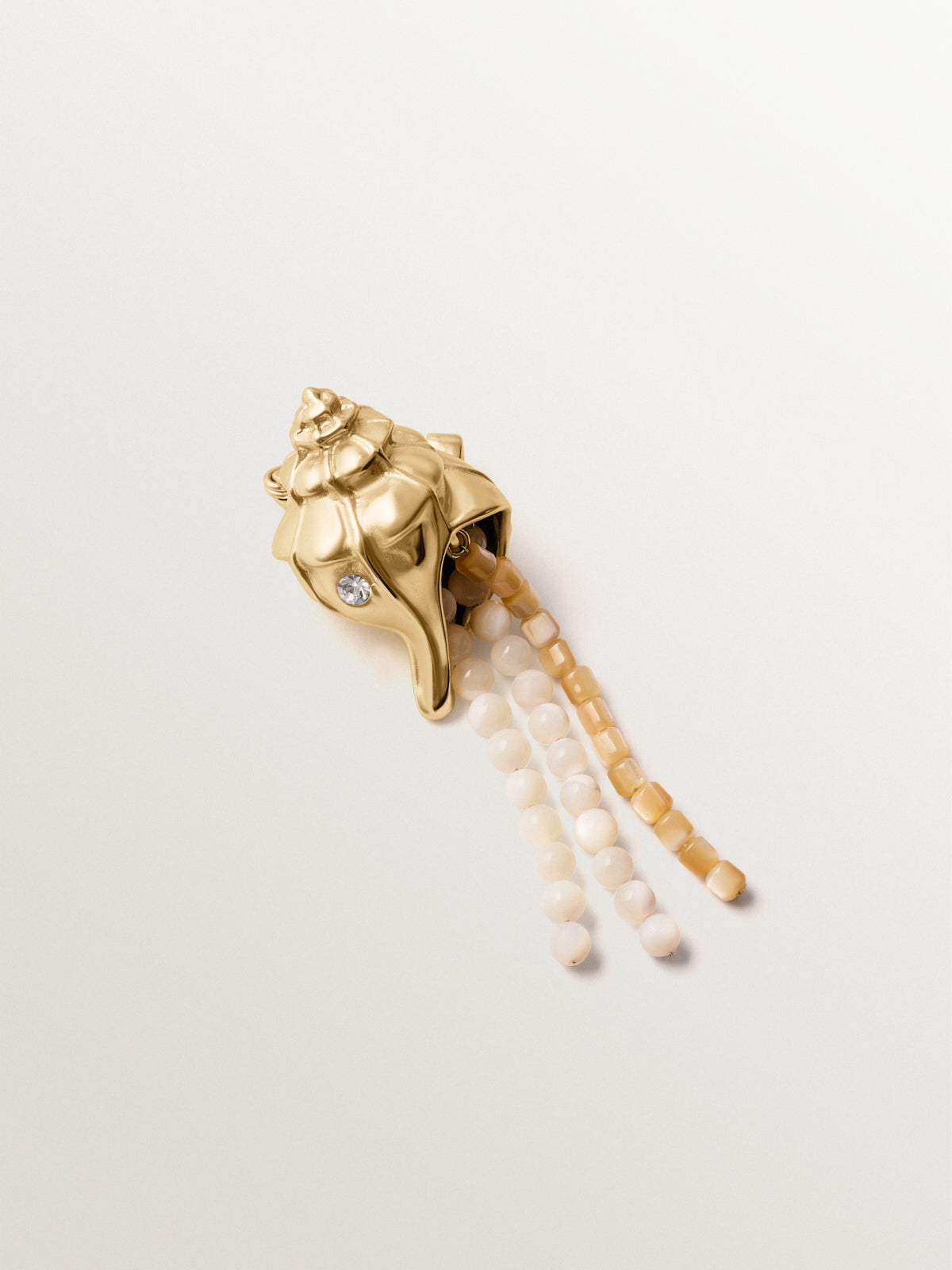 Yellow gold plated brooch with crystals, white balls and shell shape