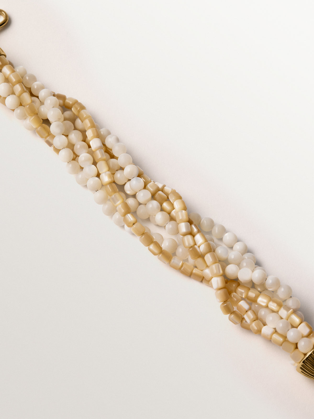 Yellow gold-plated bracelet with mother-of-pearl beads