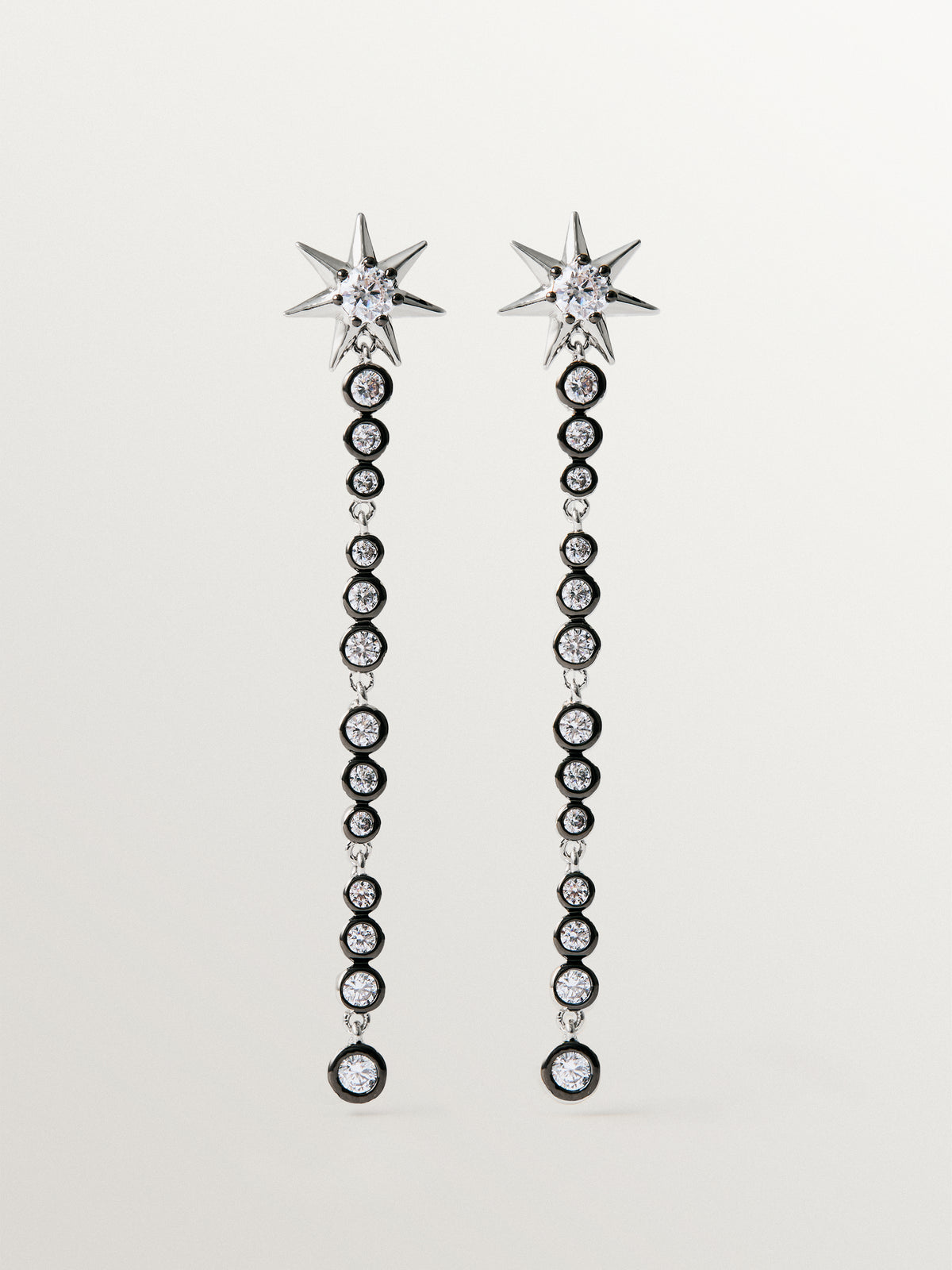 Two-tone long earrings with crystals and stars