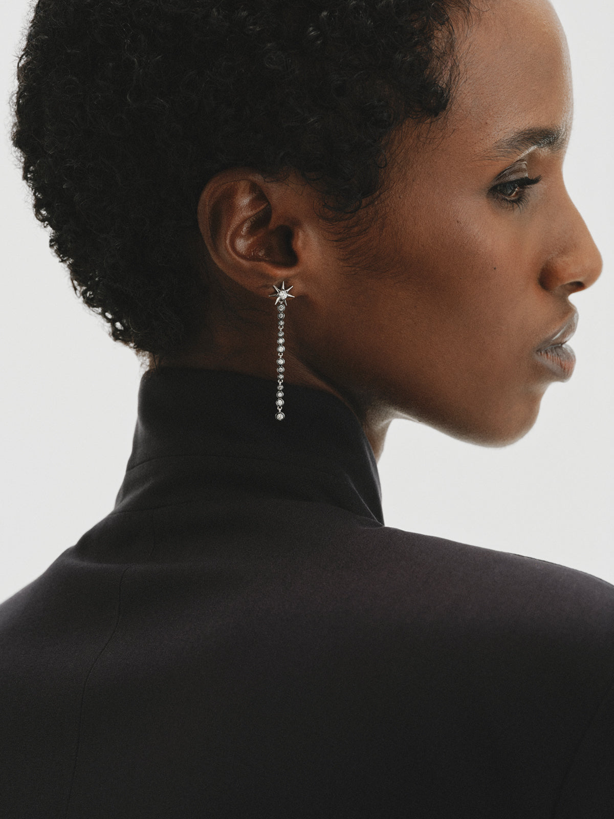 Two-tone long earrings with crystals and stars