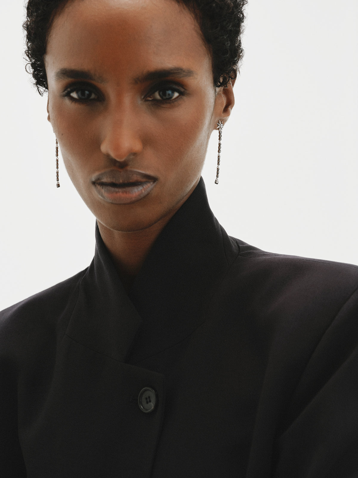 Two-tone long earrings with crystals and stars
