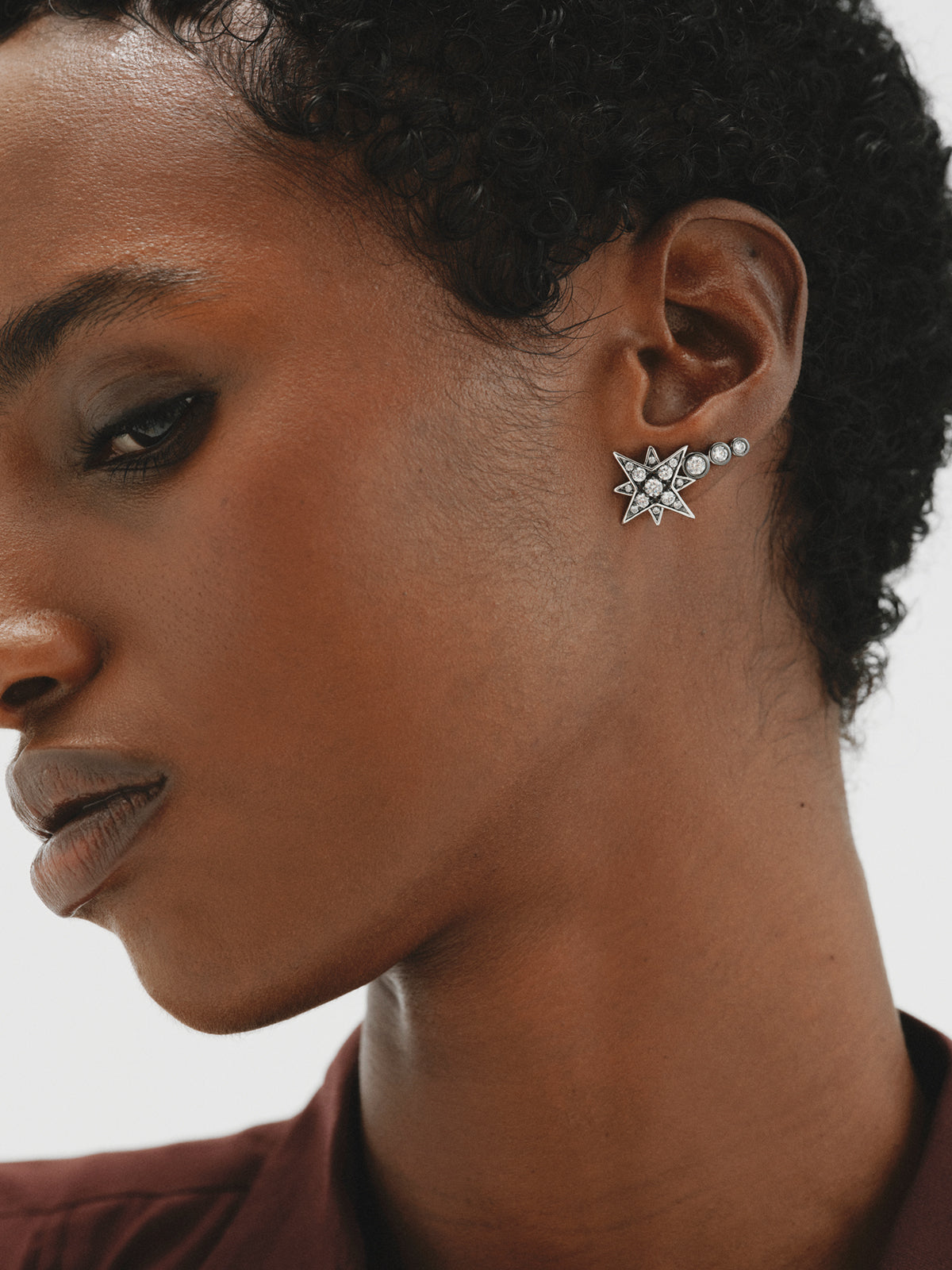 Two-tone ear climber earrings with star-shaped crystals