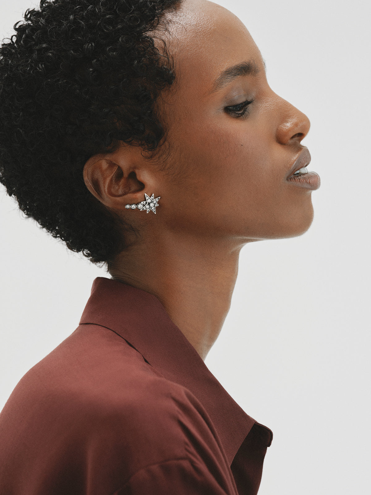 Two-tone ear climber earrings with star-shaped crystals