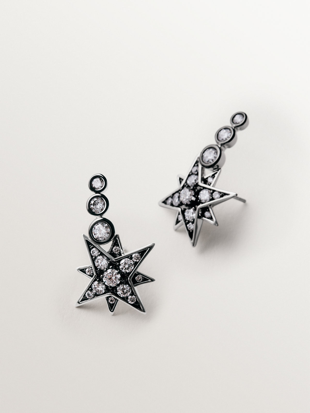 Two-tone ear climber earrings with star-shaped crystals
