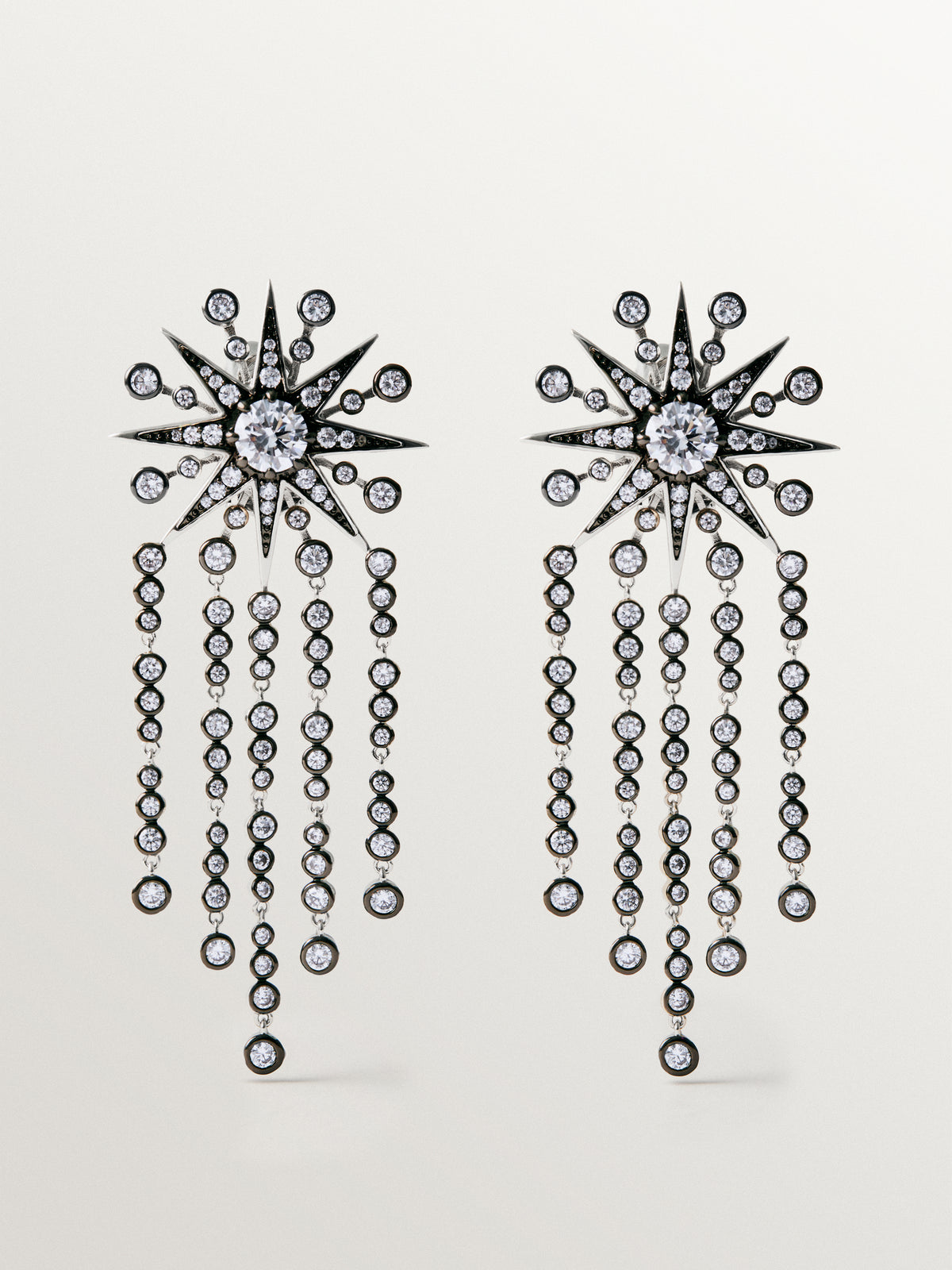 Two-tone cascading earrings with crystals and stars