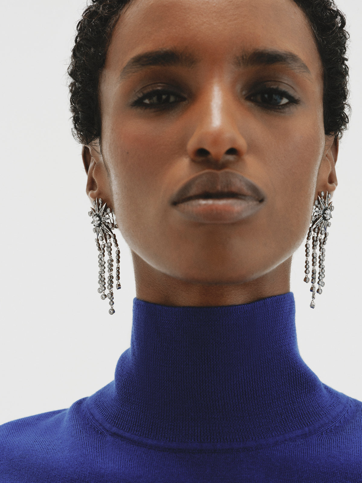 Two-tone cascading earrings with crystals and stars