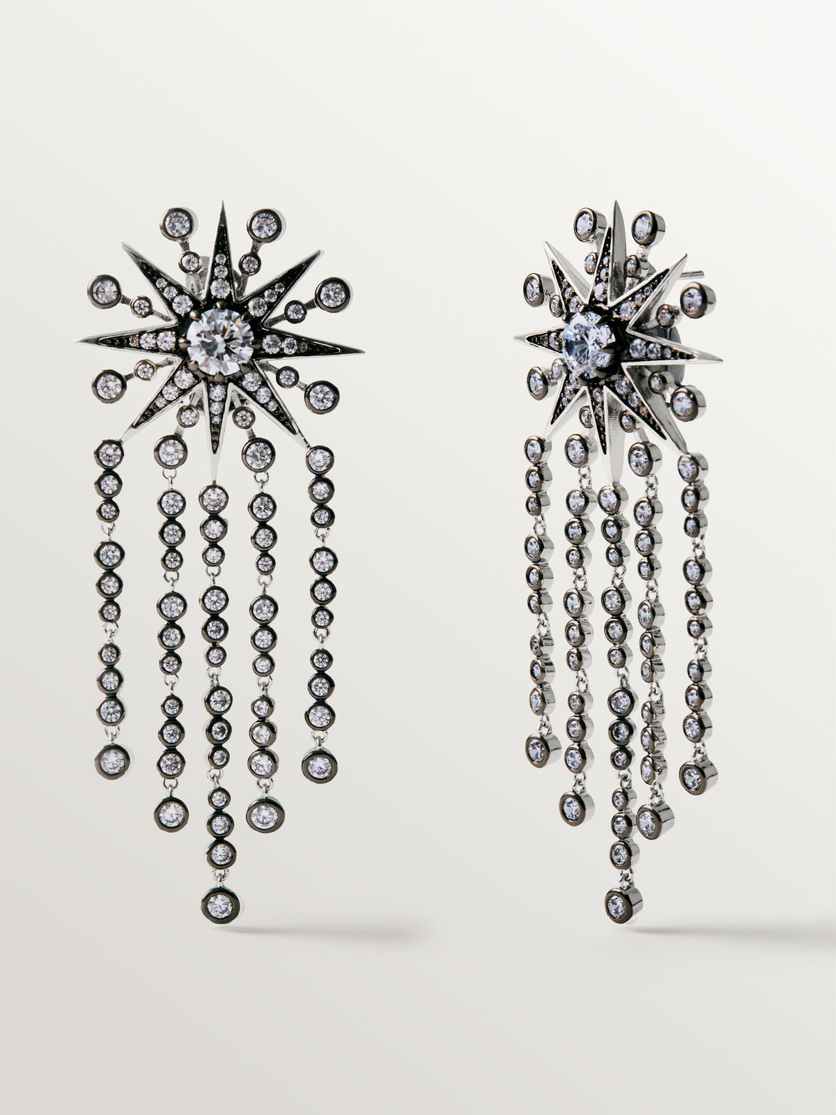 Two-tone cascading earrings with crystals and stars
