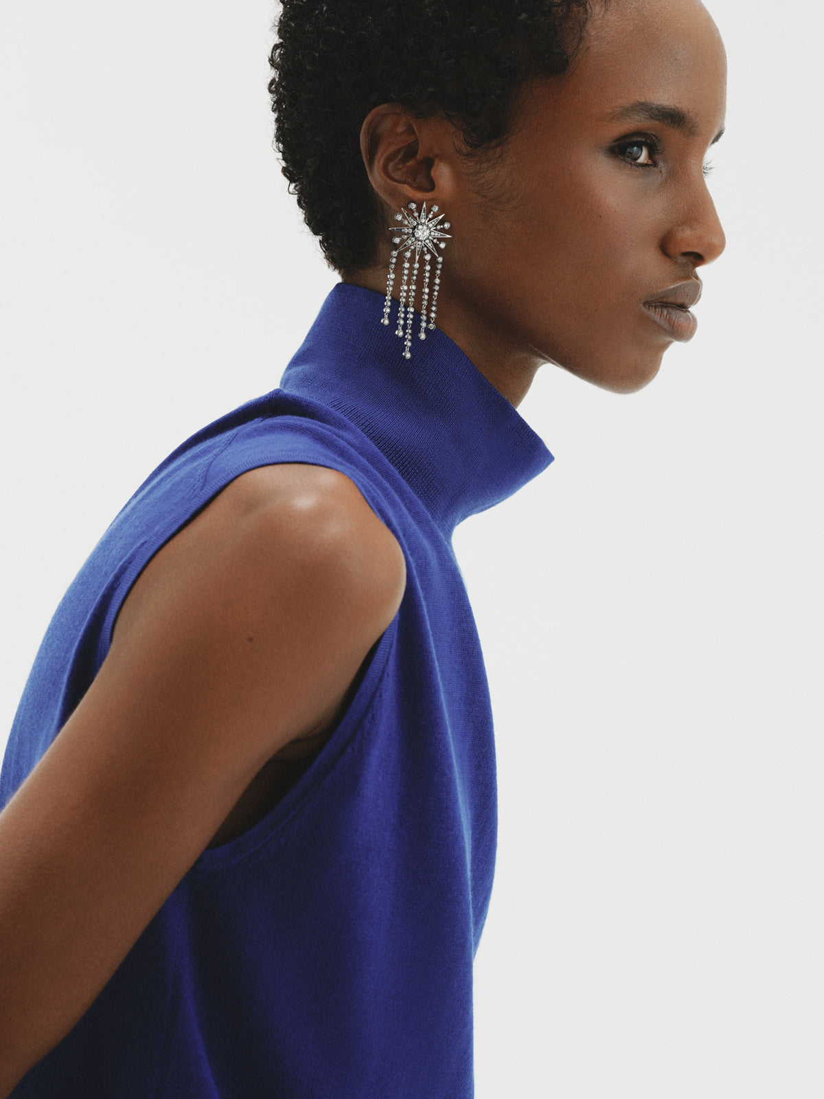 Two-tone cascading earrings with crystals and stars