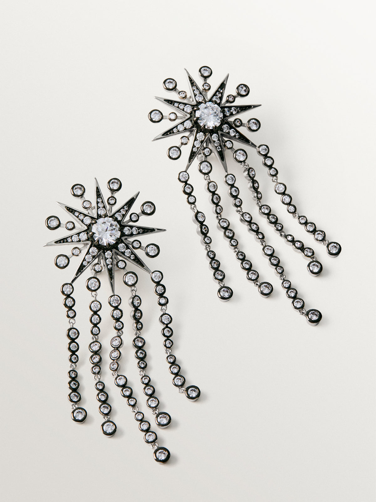 Two-tone cascading earrings with crystals and stars