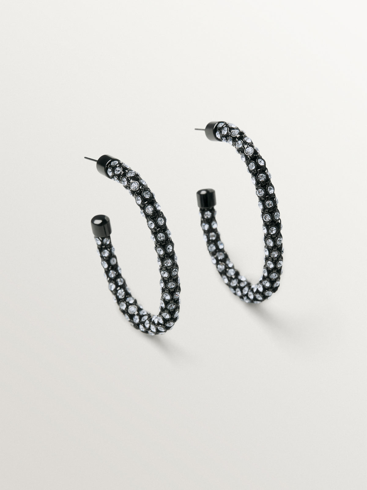 Tube-shaped hoop earrings with crystals