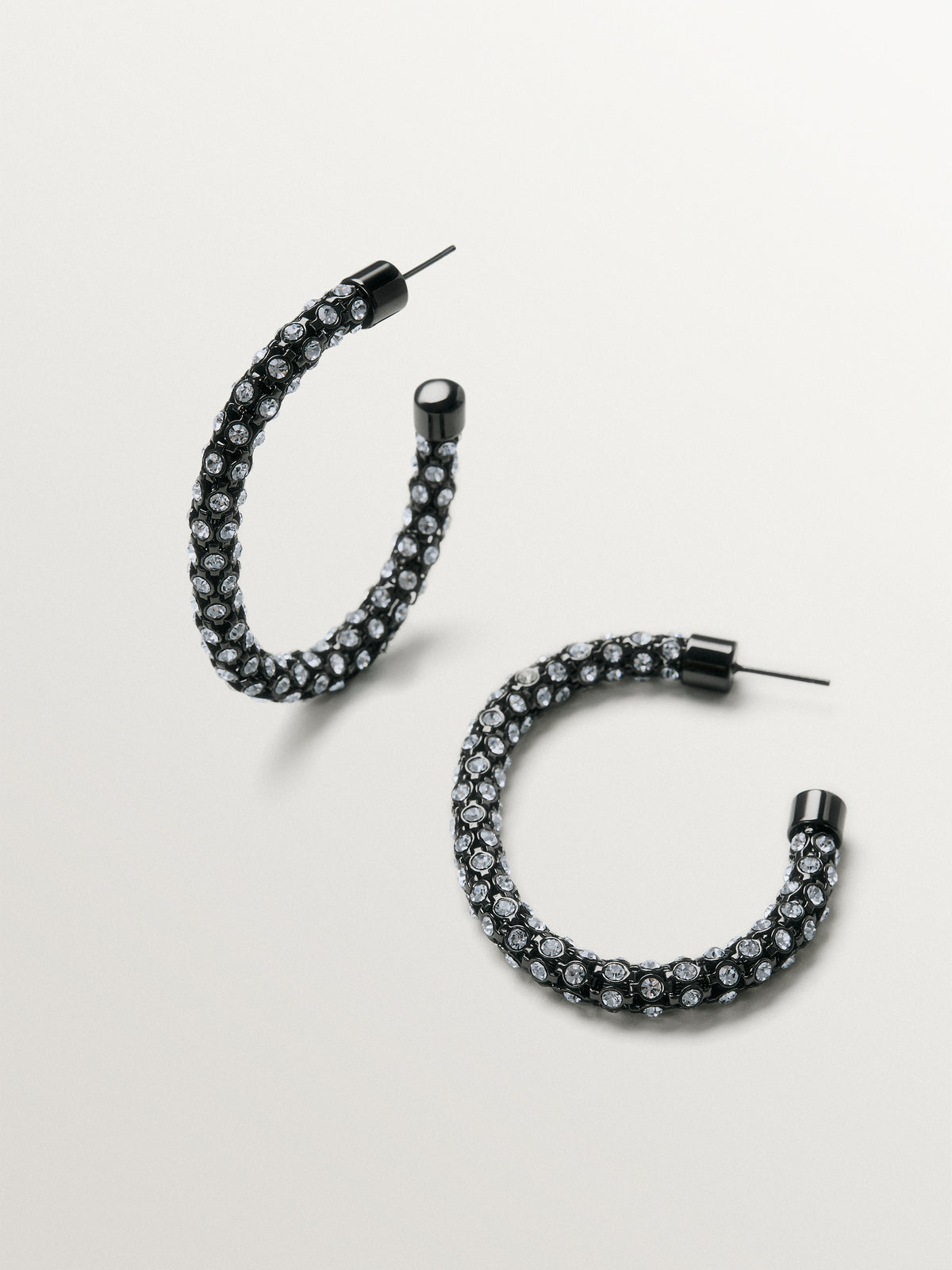 Tube-shaped hoop earrings with crystals