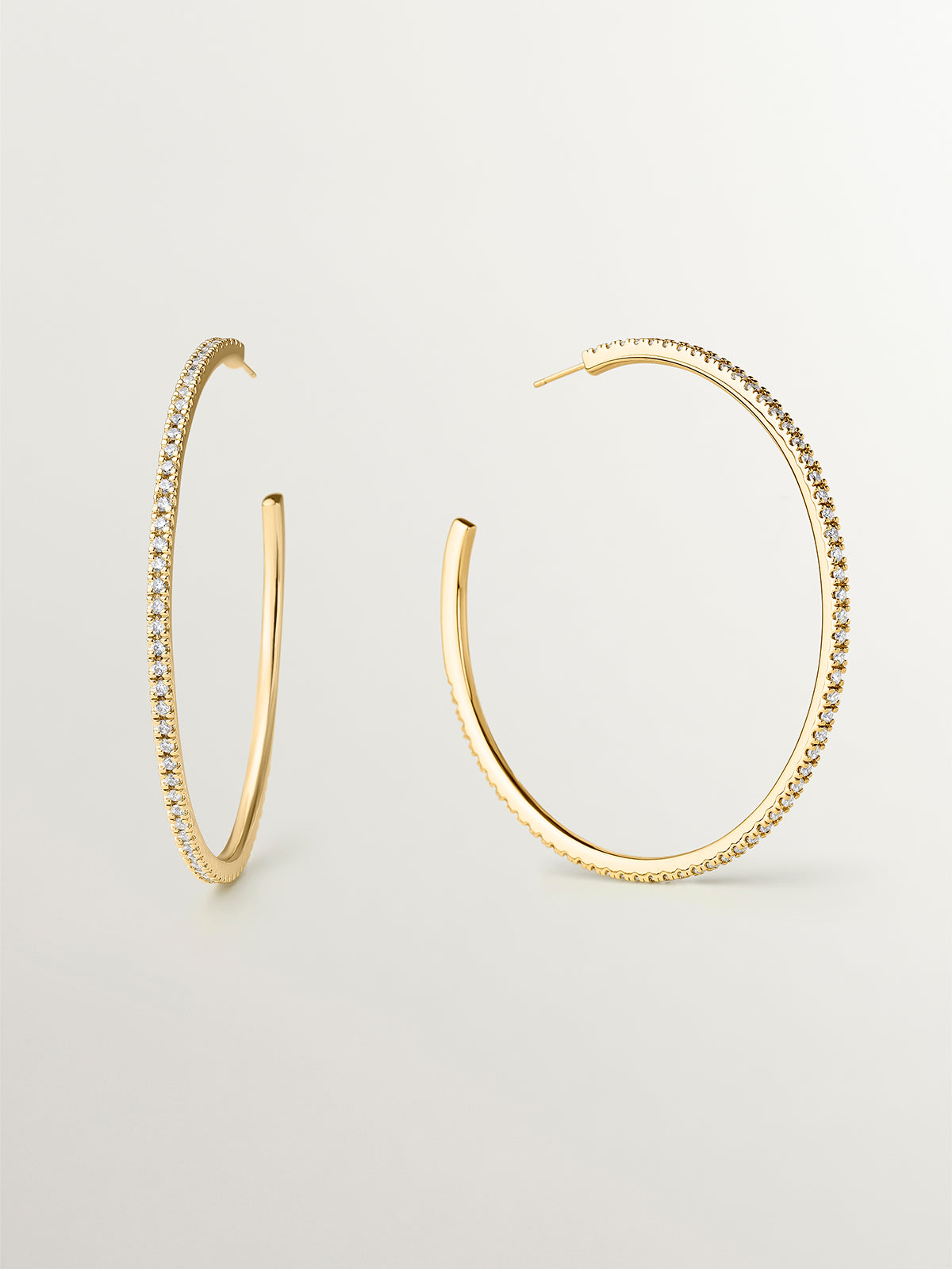 Large yellow gold-plated hoop earrings with crystals