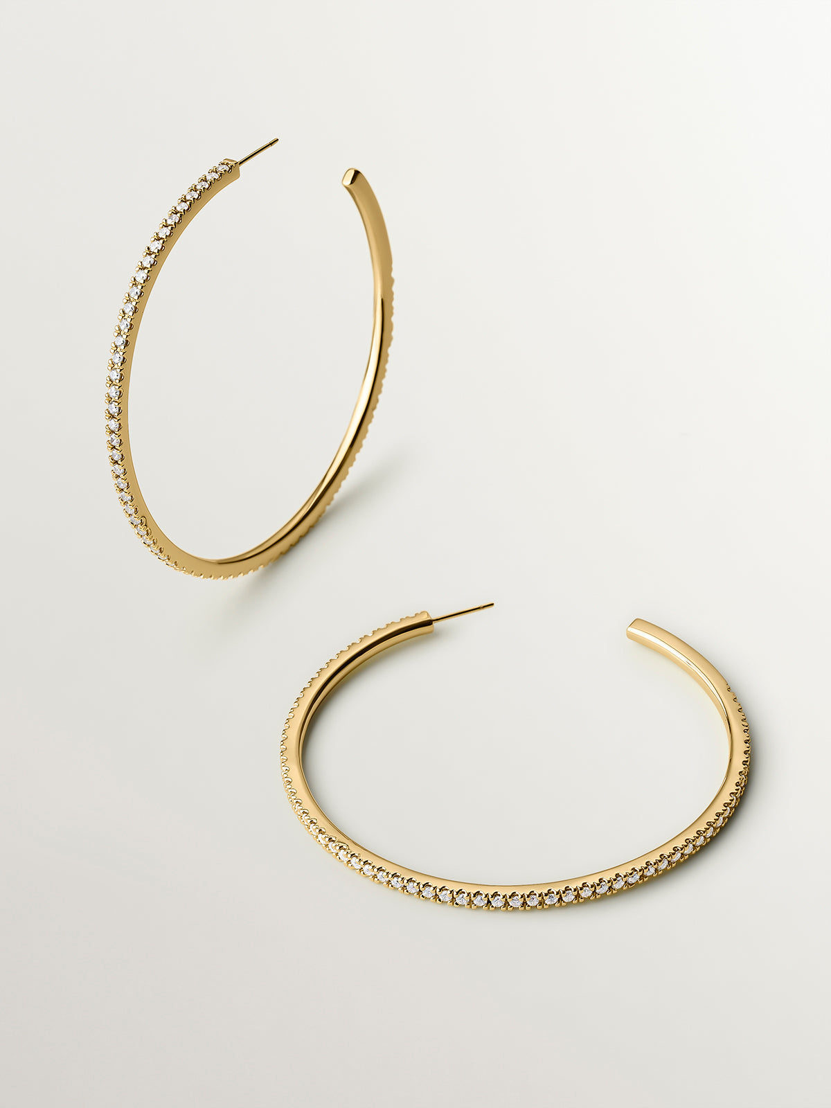 Large yellow gold-plated hoop earrings with crystals