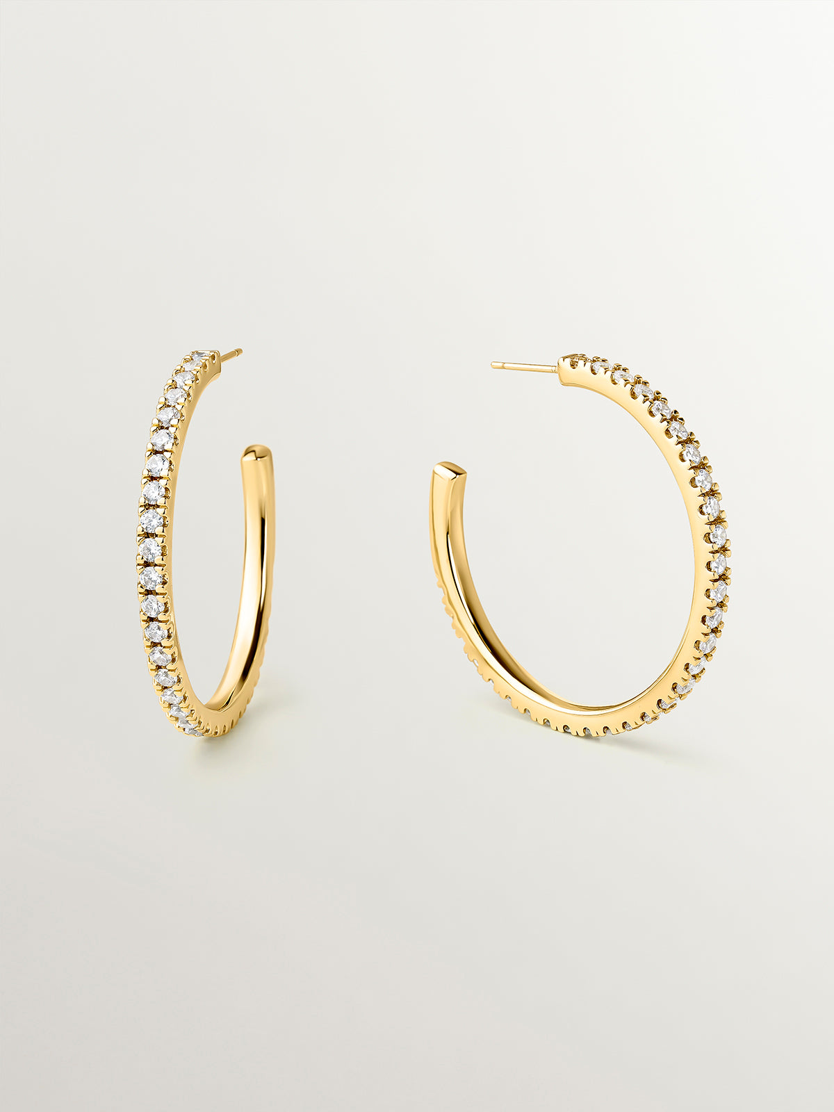Medium yellow gold-plated hoop earrings with crystals