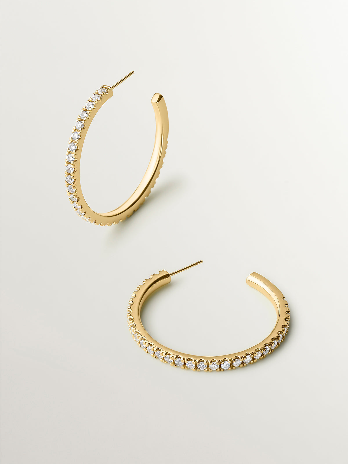 Medium yellow gold-plated hoop earrings with crystals
