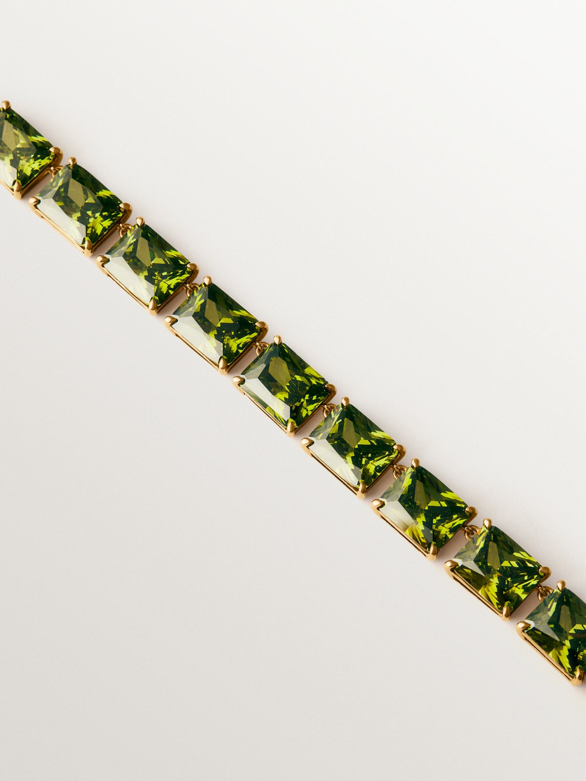 Yellow gold-plated necklace with green crystals