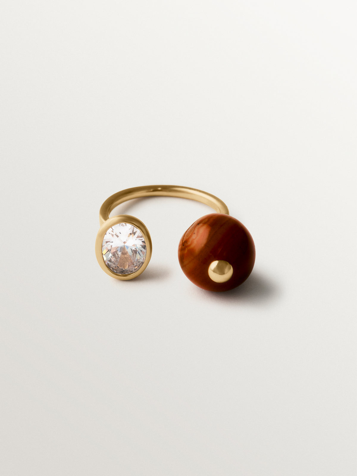 Open ring with brushed 18K yellow gold plating, red agate, topaz and sphere motif