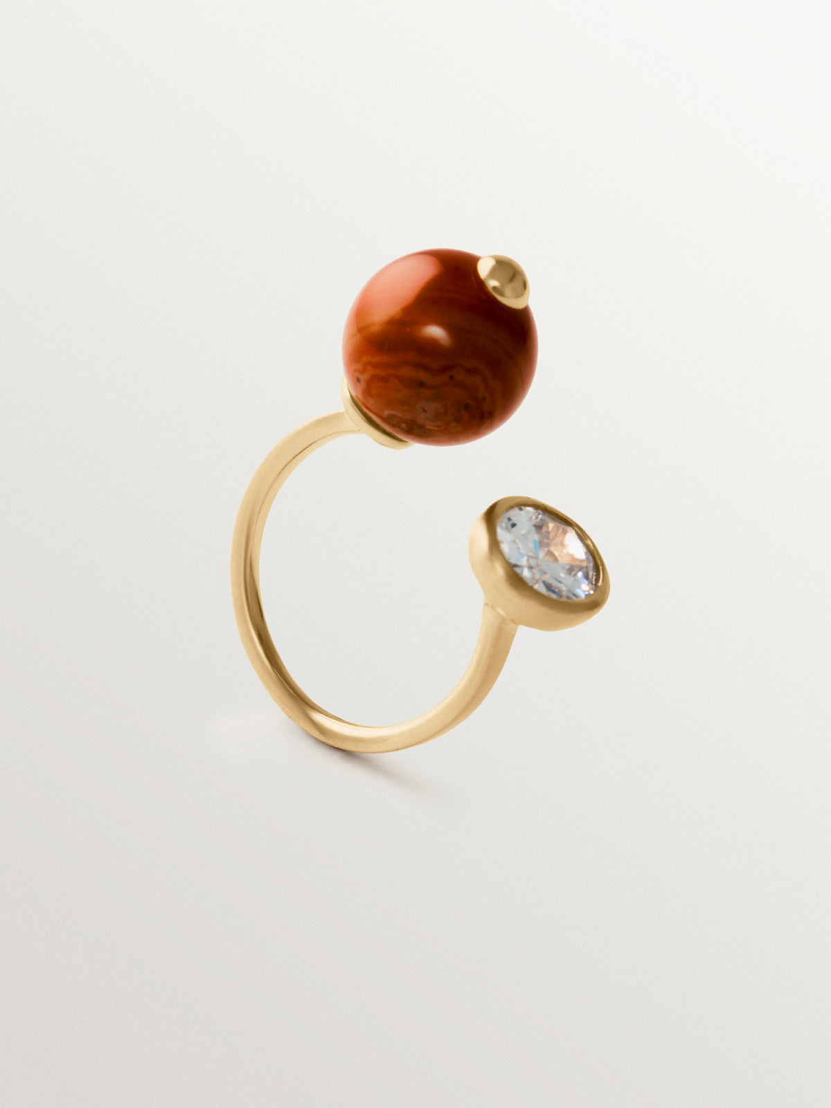 Open ring with brushed 18K yellow gold plating, red agate, topaz and sphere motif