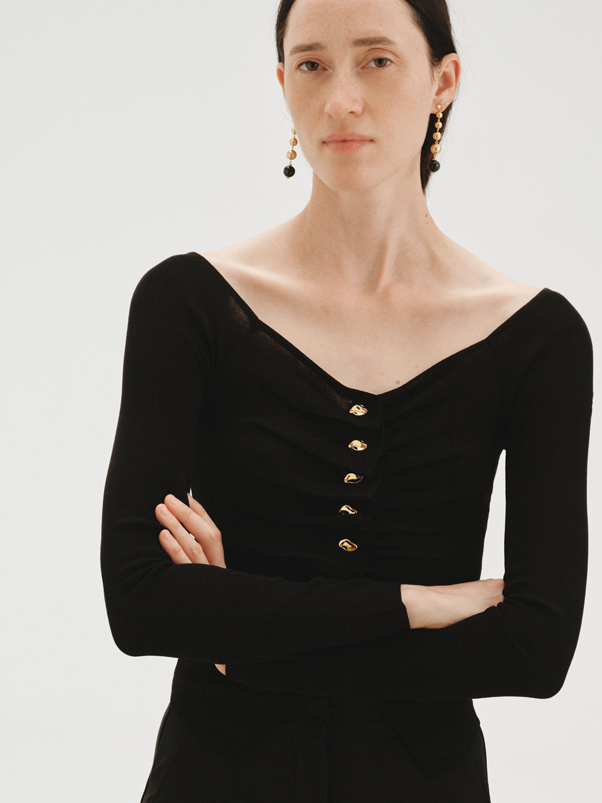 Long earrings with brushed 18K yellow gold plating, black agate and sphere motifs