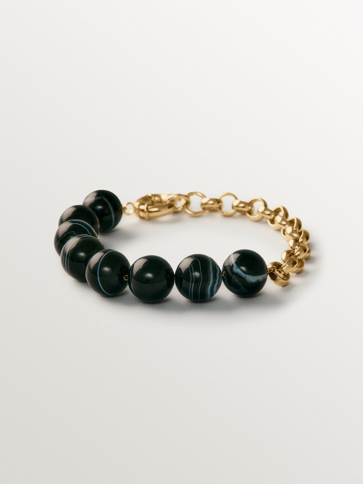 Yellow gold-plated bracelet with black agate and sphere motif