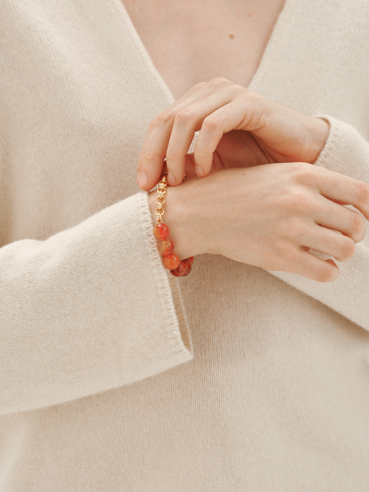 Yellow gold-plated bracelet with red agate and sphere motif