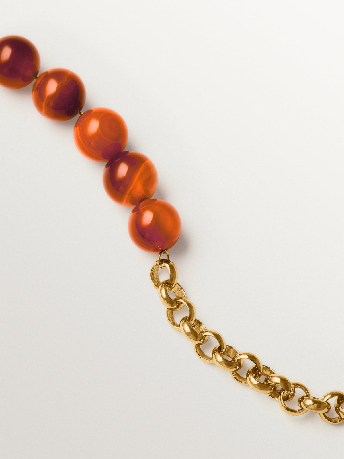 Yellow gold-plated bracelet with red agate and sphere motif