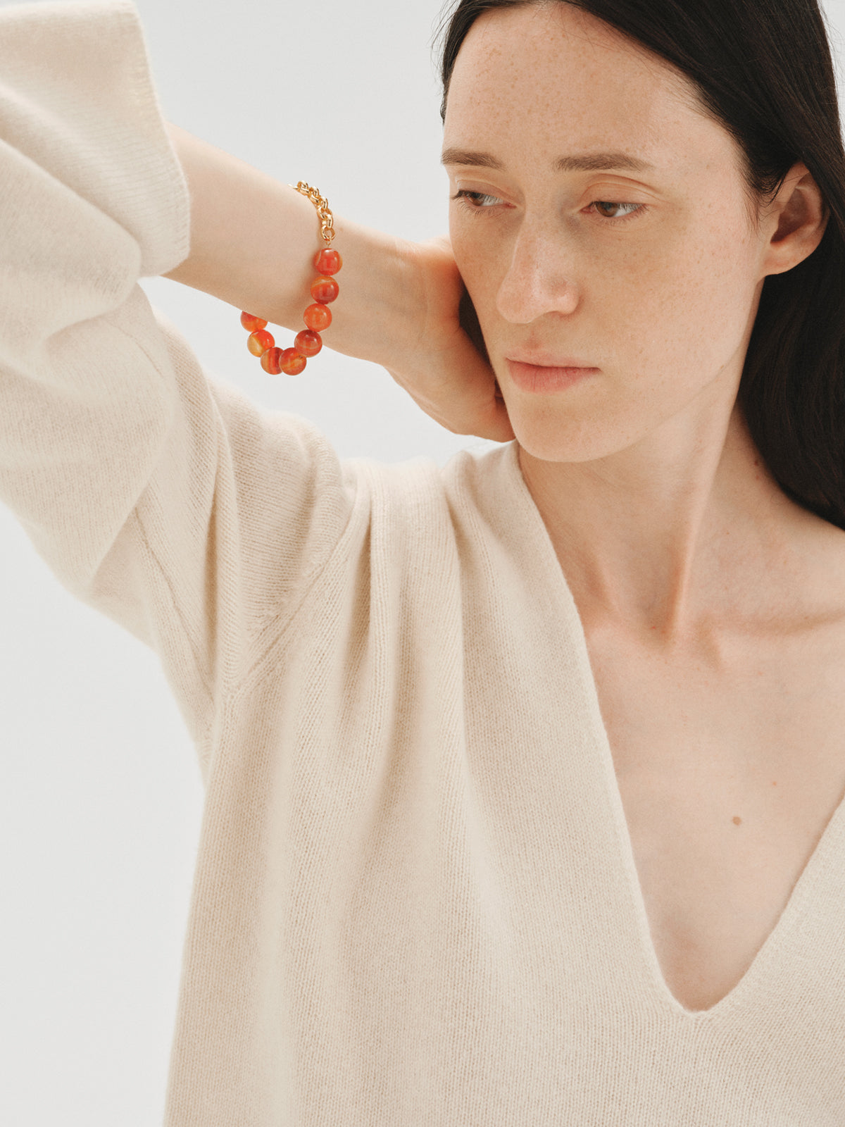 Yellow gold-plated bracelet with red agate and sphere motif