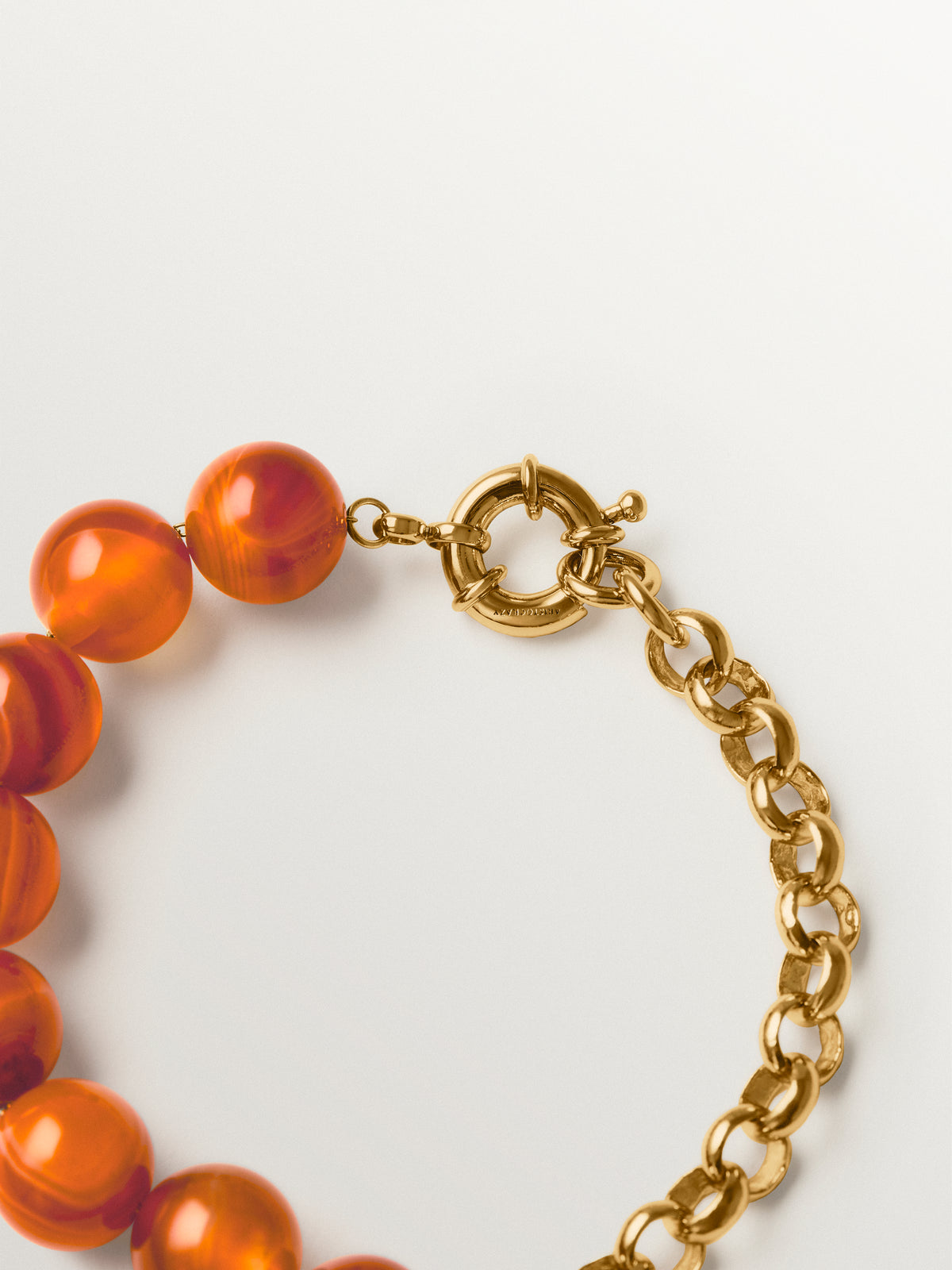 Yellow gold-plated bracelet with red agate and sphere motif