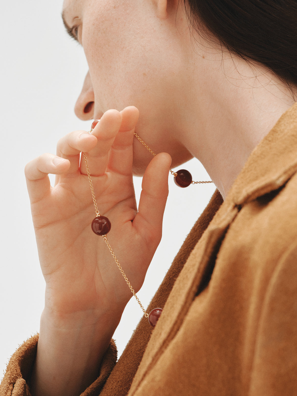 Yellow gold-plated necklace with red agate and sphere motif