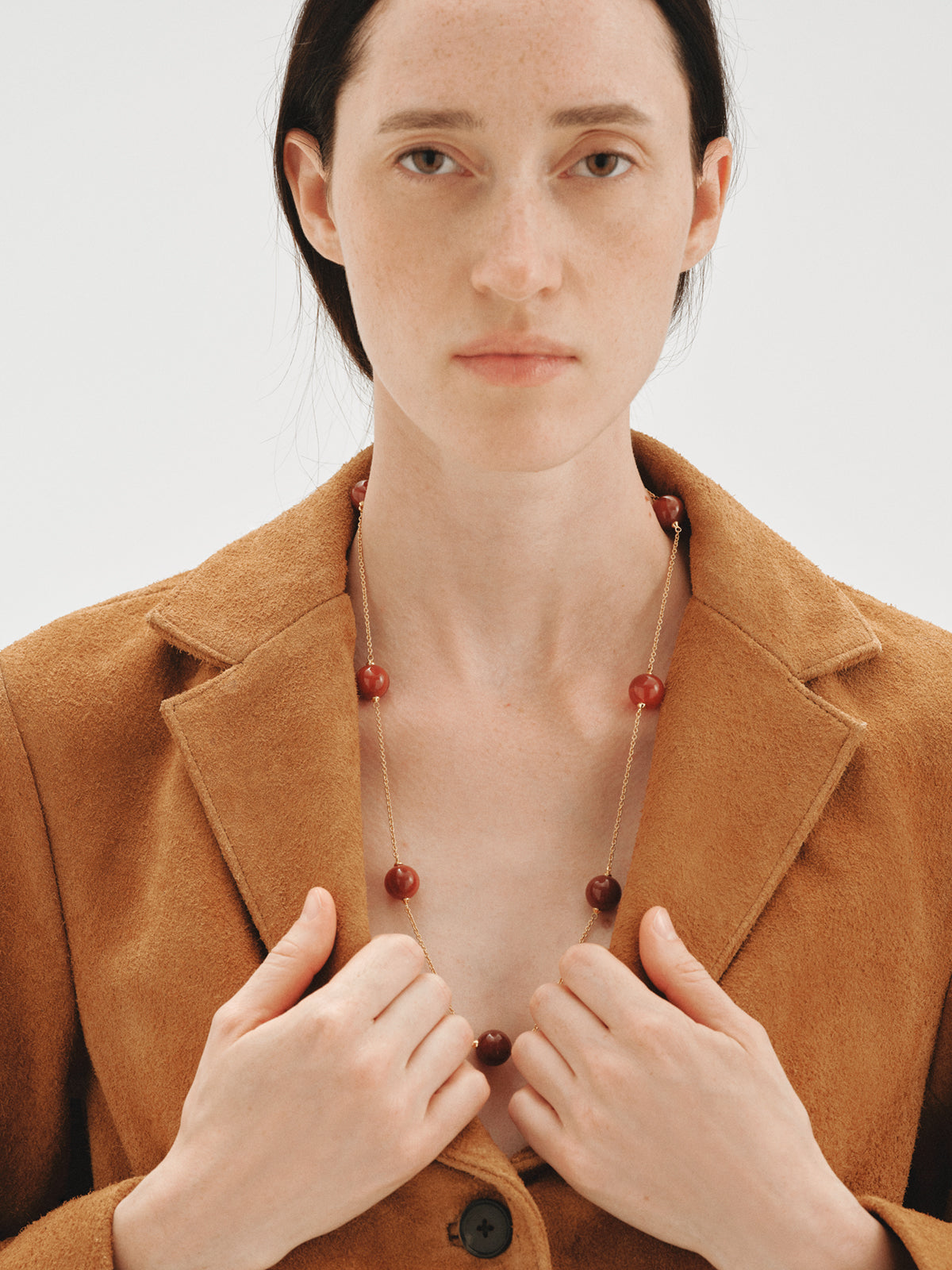 Yellow gold-plated necklace with red agate and sphere motif