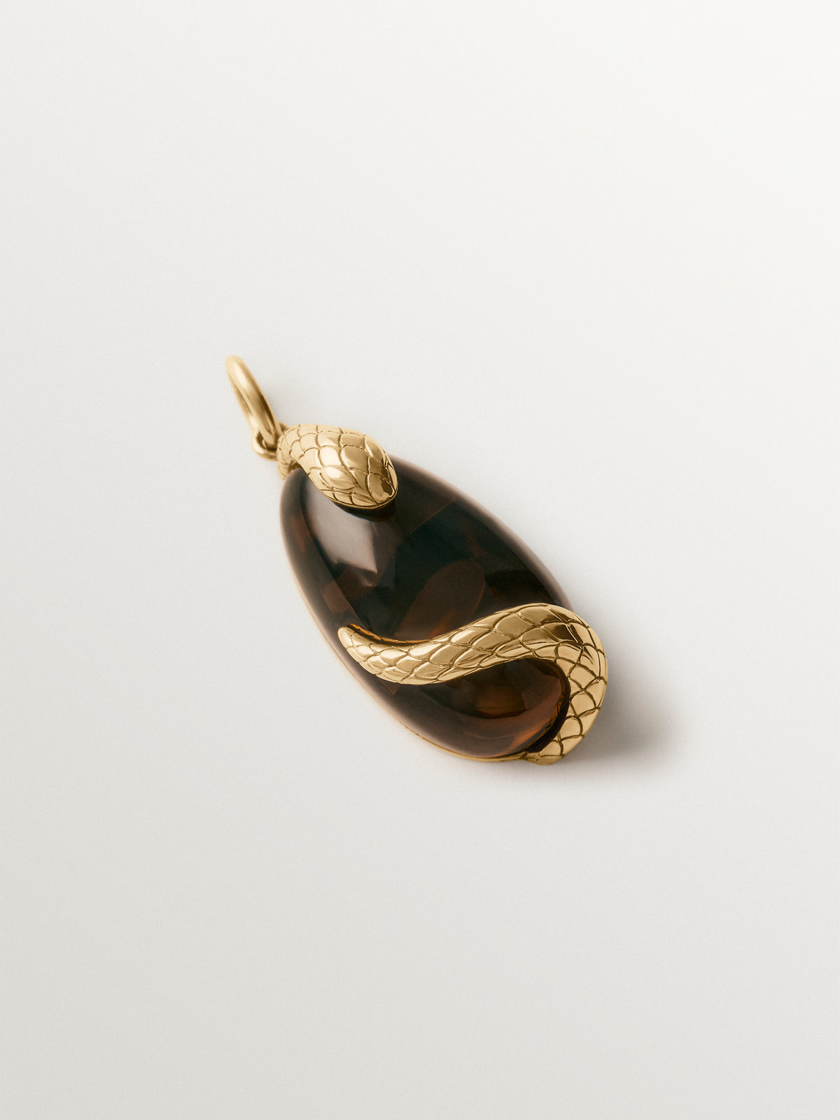 Yellow gold-plated charm with brown crystal and snake motif