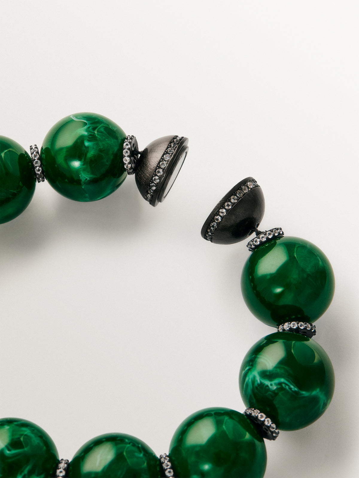 Bracelet with green resin, crystals and sphere motifs
