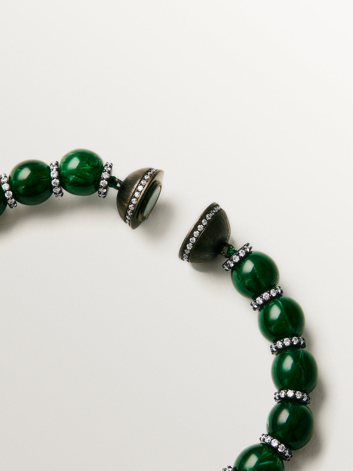 Bracelet with green resin, crystals, sphere motifs and gunmetal finish