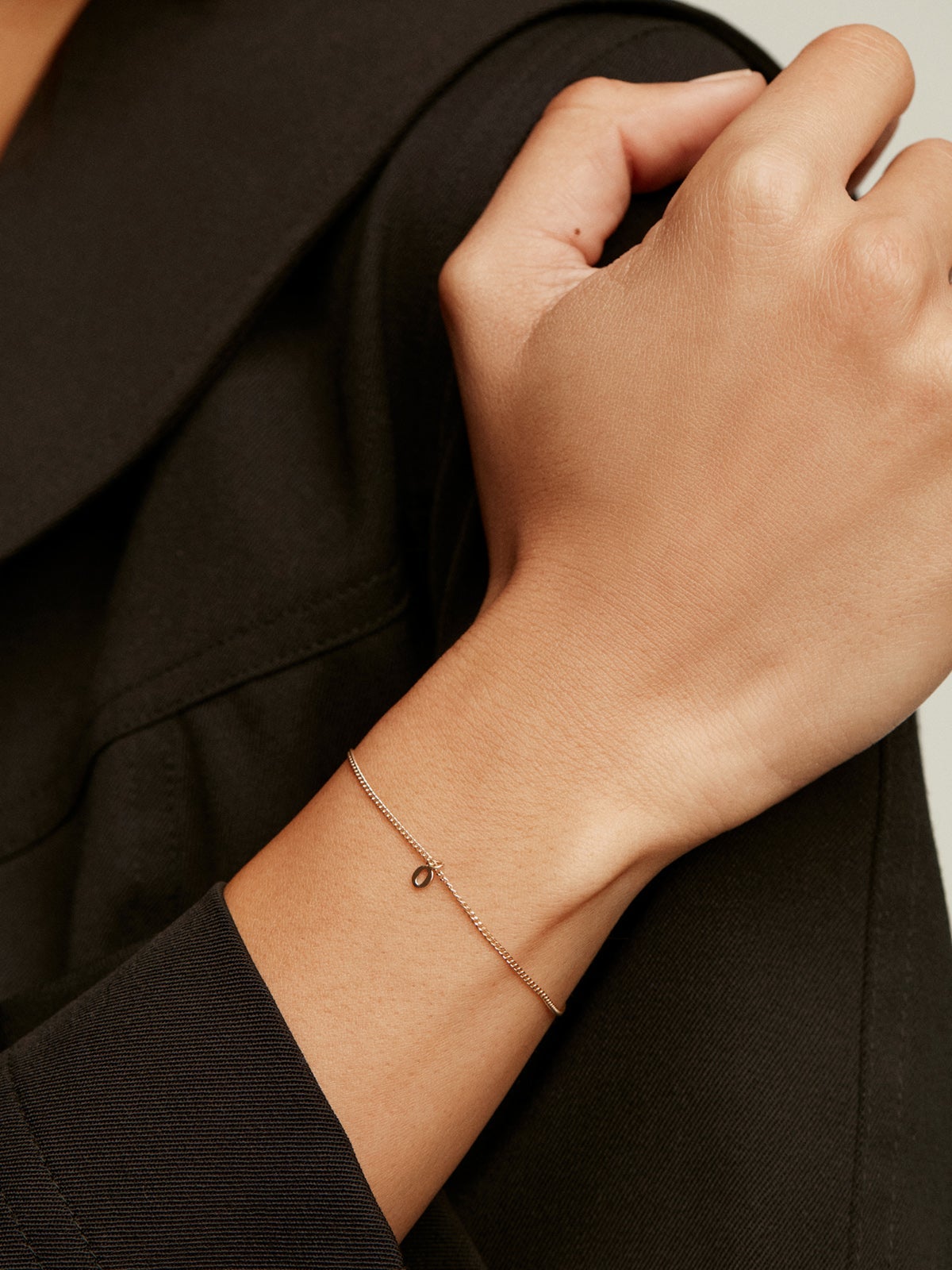 14K yellow gold charm with number 0