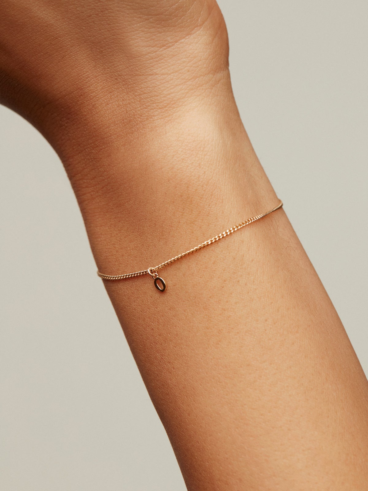 14K yellow gold charm with number 0