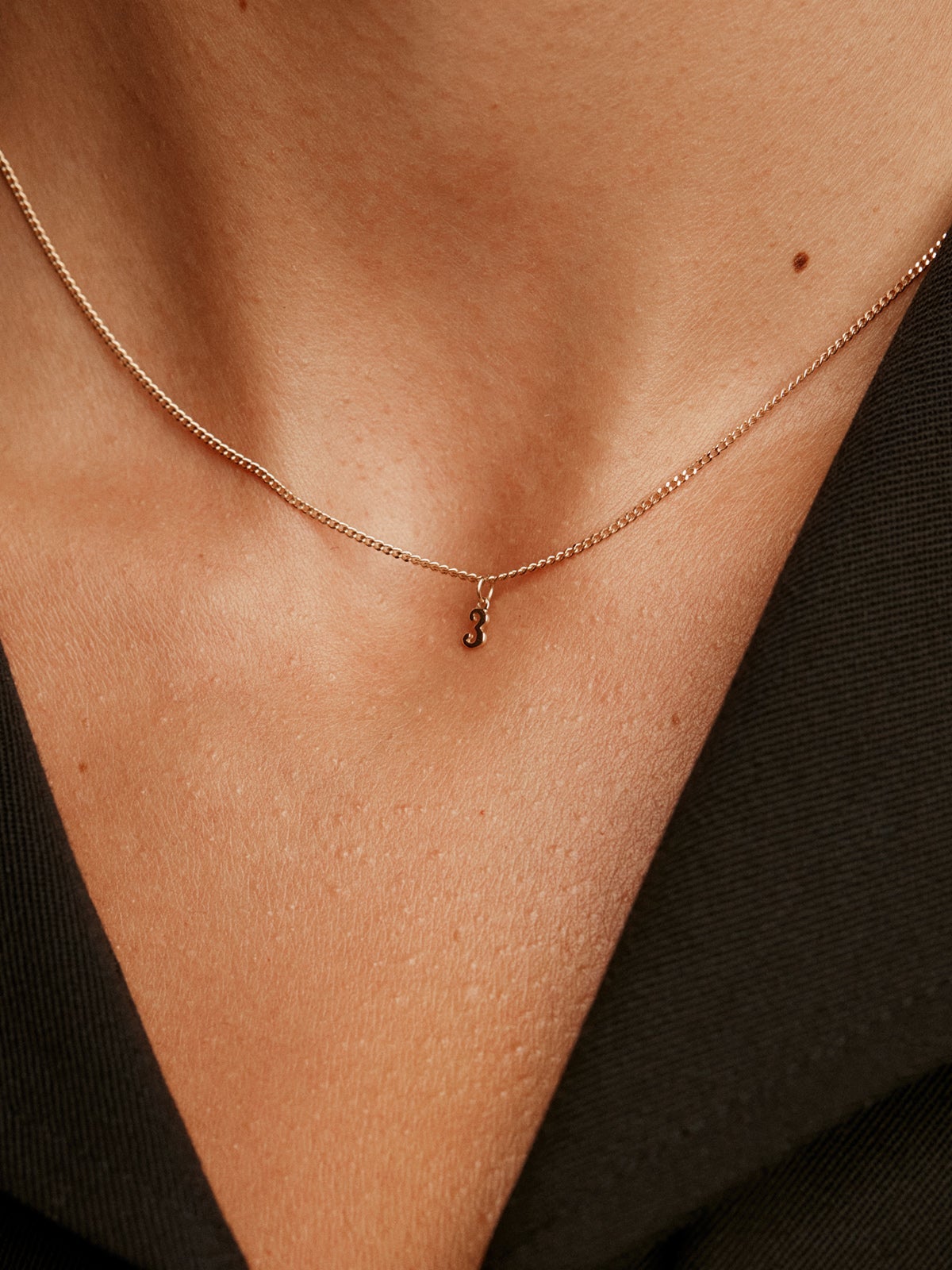 14K yellow gold charm with number 3