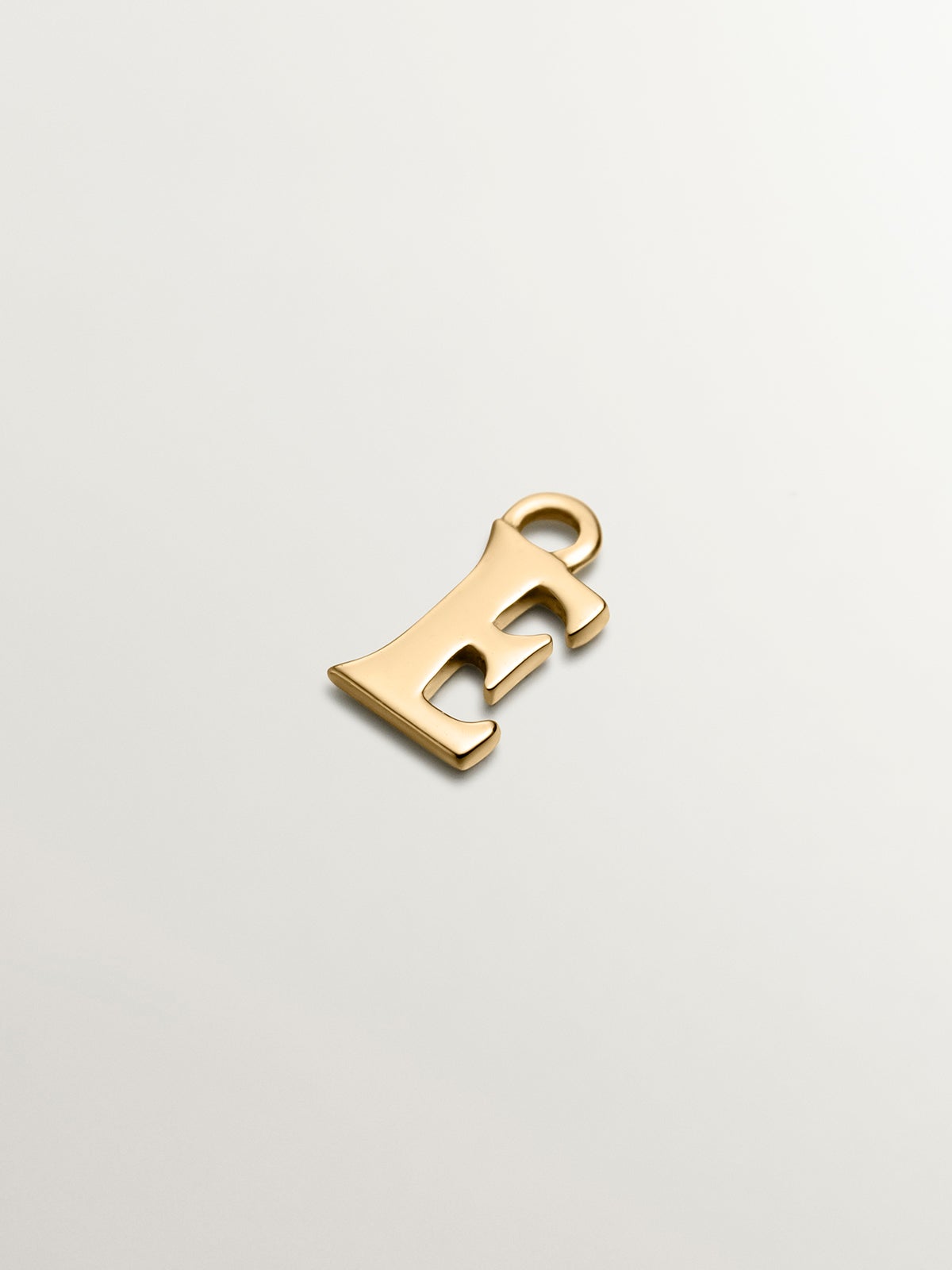 14K yellow gold charm with letter E