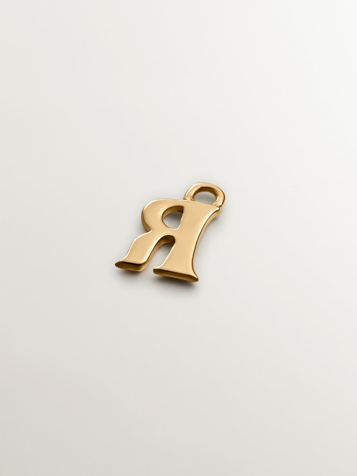 14K yellow gold charm with letter R