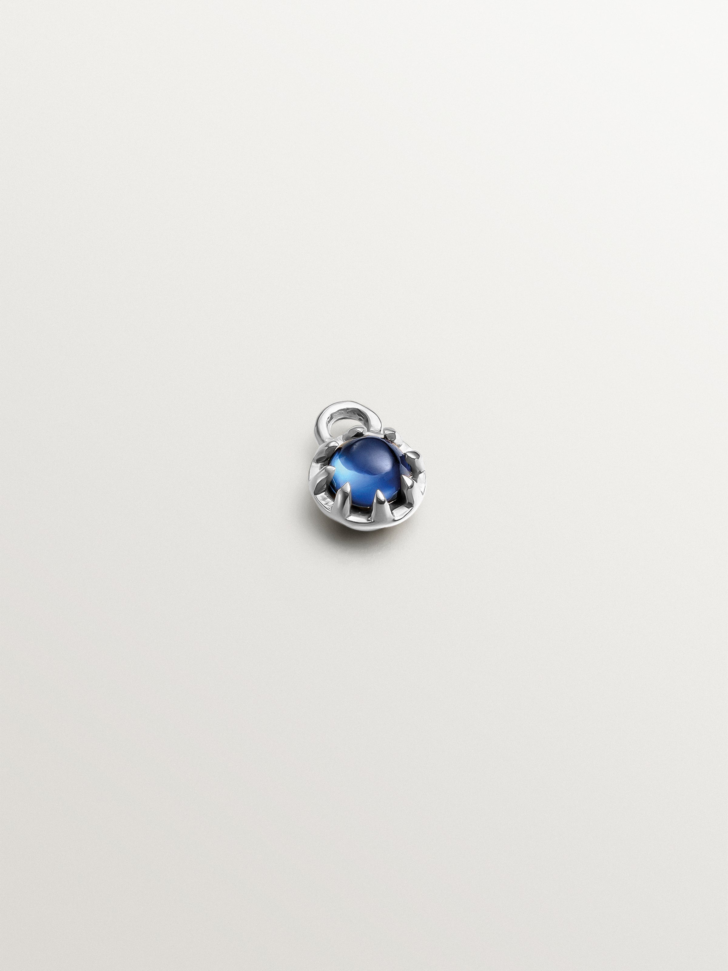 14K white gold charm with blue sapphire