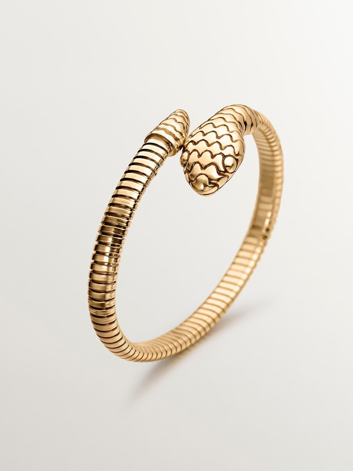 Rigid bracelet in 925 silver plated in 18K yellow gold in the shape of a snake