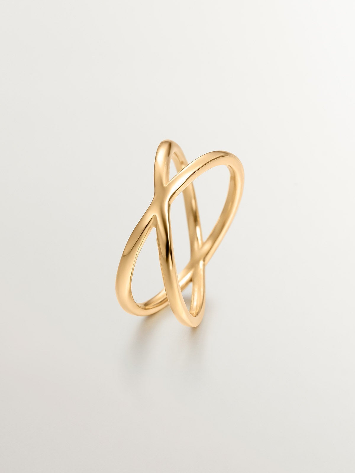 Double Crossed Ring made of 925 Silver coated in 18K Yellow Gold.