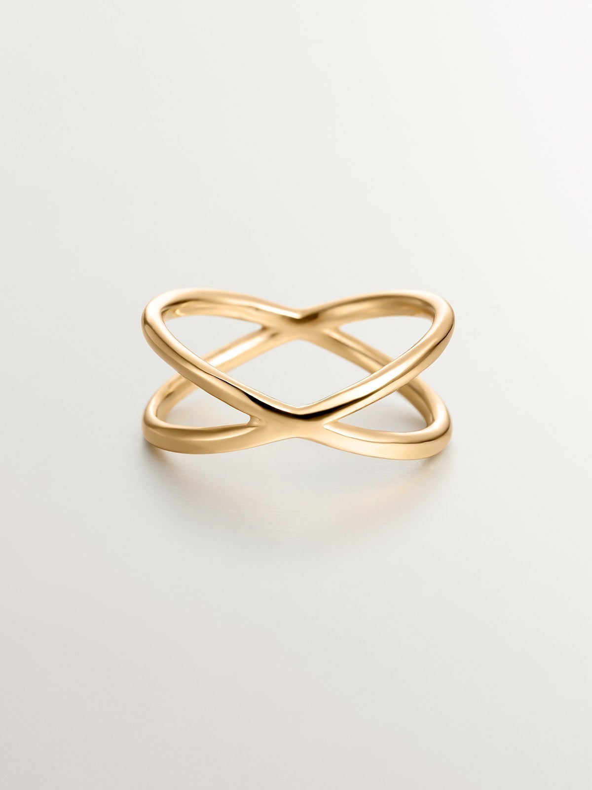 Double Crossed Ring made of 925 Silver coated in 18K Yellow Gold.